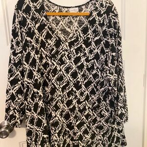 Long sleeve black-and-white shirt. The fabric has textured to it.